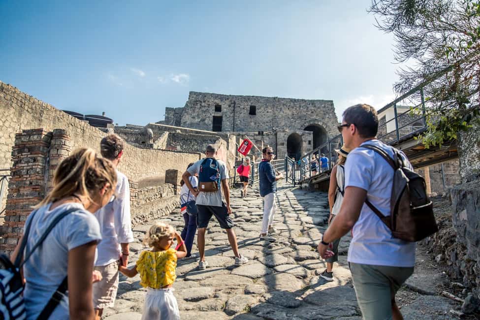From Naples: Pompeii Skip-the-Line Guided Tour - Via dell’Abbondanza: Street Life, Shops, and Chariot Grooves