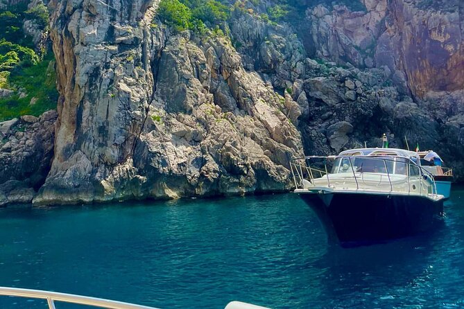 Half Day Private Boat Tour of Capri - I Faraglioni: the rocks, the arch photo, and Villa Malaparte from the sea