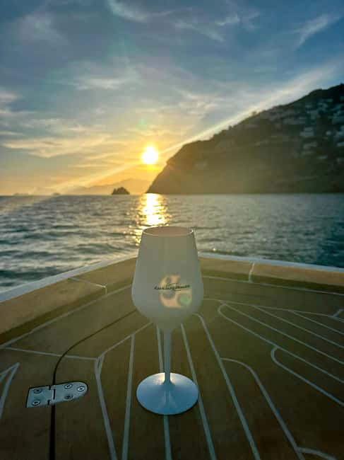 Positano: Shared Sunset Cruise - Seeing Positano from afar at dusk (the payoff)