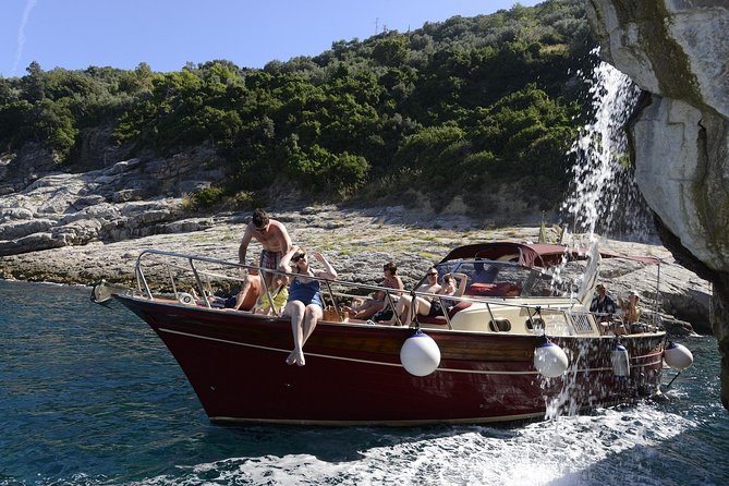 Small Group Boat Tour Capri & Blue Grotto with Swimming Stops - Sorrento coast highlights before Capri: Marina Grande, ruins, and a waterfall