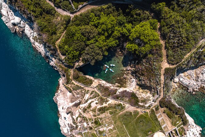 Small group paddle boarding tour to Bagni Regina Giovanna - Punta del Capo: Roman Villa Pollio Felice and the Coastal Power of Getting There by Water