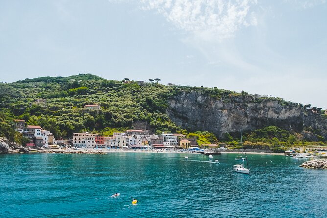 Sorrento Coast Cruise with Limoncello Tasting - Marina di Puolo and Capri’s silhouette on the horizon